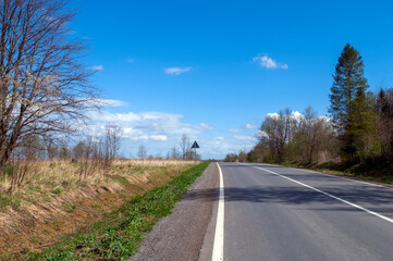 Fototapeta premium highways in the mountains against the background of the sunny sky and the white clouds