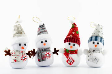 Snowman in the snow. New Year Merry Christmas. Red hat. On white background. Lots of snowmen. Christmas decorations. Santa.