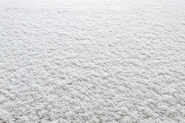 winter background: fresh clean even snow, large snowflakes