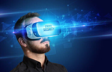 Businessman looking through Virtual Reality glasses, virtual security concept