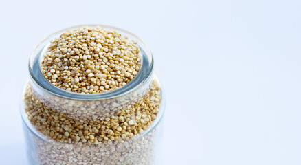 Organic Quinoa in a jar on white background.