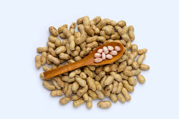 Raw peanuts on white background.