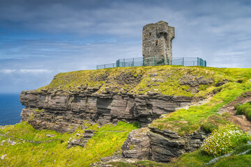 Old Moher Tower on Hags Head, watchtower at the southern end of Cliffs of Moher, popular tourist attraction, Wild Atlantic Way, County Clare, Ireland