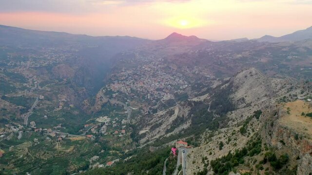 Aerial Forward Beautiful Shot Of Houses On Mountain Landscape Against Sky During Sunset - Bsharri, Lebanon