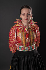 Young beautiful slovak woman in traditional dress. Slovak folklore