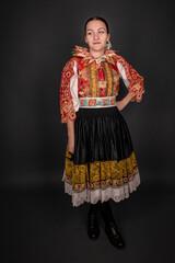 Young beautiful slovak woman in traditional dress. Slovak folklore