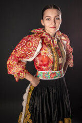 Young beautiful slovak woman in traditional dress. Slovak folklore