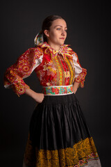 Young beautiful slovak woman in traditional dress. Slovak folklore
