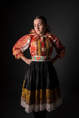 Young beautiful slovak woman in traditional dress. Slovak folklore