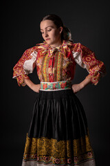 Young beautiful slovak woman in traditional dress. Slovak folklore