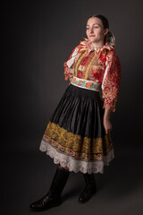 Young beautiful slovak woman in traditional dress. Slovak folklore