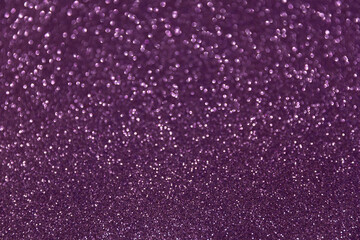 Glitter sparkling purple texture. Beautiful Christmas and new year bokeh blurred background
