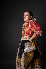 Young beautiful slovak woman in traditional dress. Slovak folklore