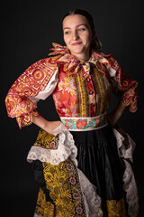 Young beautiful slovak woman in traditional dress. Slovak folklore