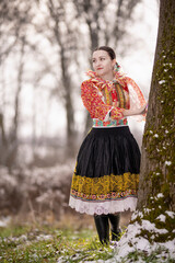 Young beautiful slovak woman in traditional dress. Slovak folklore