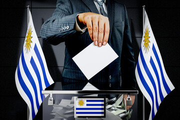 Uruguay flags, hand dropping voting card - election concept - 3D illustration
