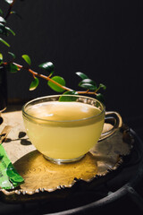 green tea in clear glass teacup