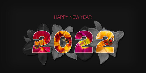 Fototapeta premium Bonne année 2022 - Lettres remplies de fleurs multicolores, entourées de fleurs détourées sur fond noir