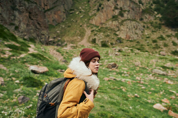 Naklejka premium woman hiker with backpack mountains travel adventure freedom