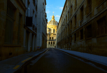 Obraz premium Cathedral on the end of the street . Narrow street of Paris 
