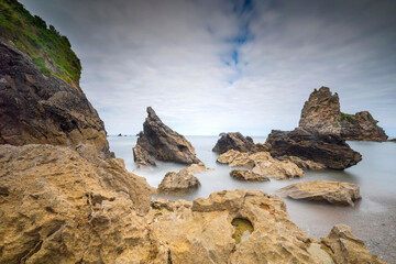 seascape along the coast of Asturias against a cloudy sky

