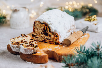 Traditional Christmass stollen on stone background.