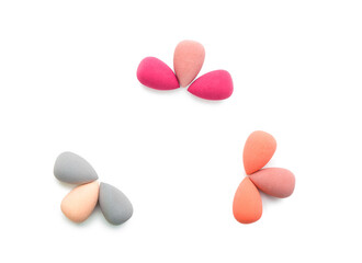 Stylish makeup sponges on white background