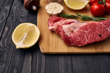 meat vegetables ingredients on a wooden board beef
