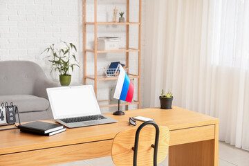 Interior of modern office with Russian flag