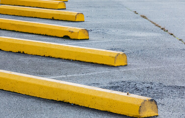 Car parking bar in the area close to Shopping Center. Outdoor parking area with yellow concrete...