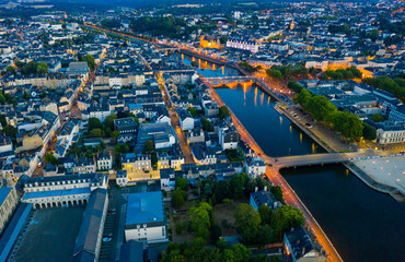 Fototapeta premium Laval city and Mayenne river in the evening. View from above. France