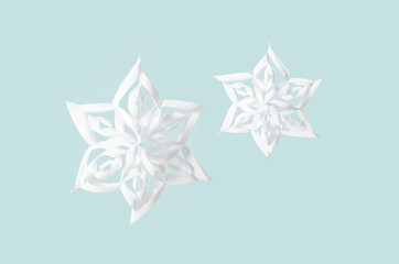 Beautiful paper snowflakes on color background