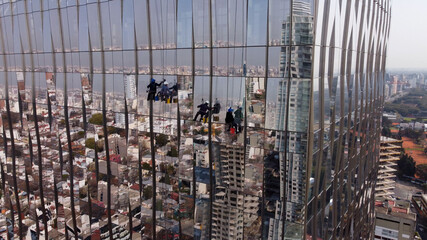 Amazing unusual aerial view of window cleaners on Buenos Aires skyscraper