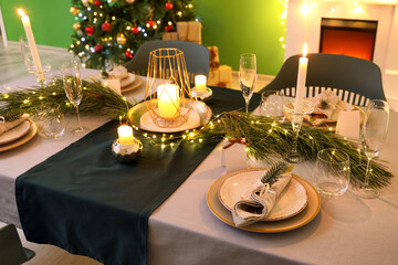 Dining table with beautiful setting in living room decorated for Christmas eve