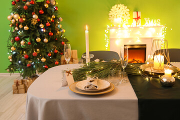 Dining table with beautiful setting in living room decorated for Christmas eve