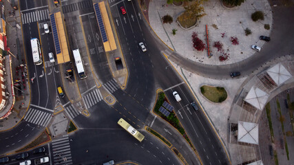 Aerial top down shot of Chacarita Bus Station in Buenos Aires and cars on the road