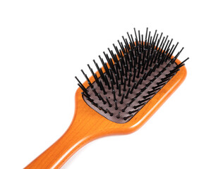 Wooden hairbrush on white background.