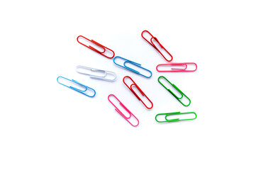 olorful paper clips on white background with copy space.