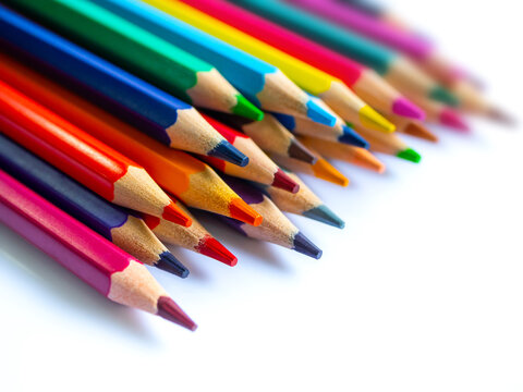 Color pencils on white background.Set of wooden color pencils arranged in bulk with copy space.Photo select focus.