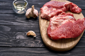 meat steak on wooden board ingredients top view food