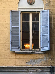 Old house window with retro light inside the room