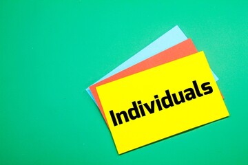 colored paper with the word individuals with a green background. individual concept