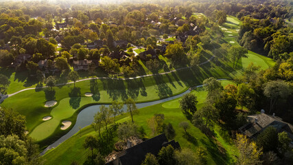 Aerial golf course images of scenic golf holes.