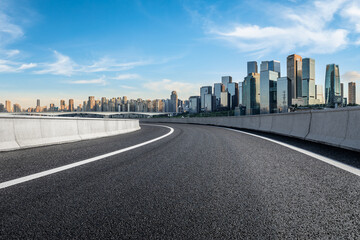 Panoramic skyline and modern commercial office buildings with empty road. Asphalt road and cityscape.
