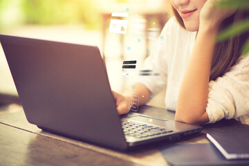 Fototapeta premium Business, technology, internet and networking concept. businesswoman working on his laptop at home, select the icon on the virtual screen.