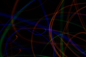 Obraz premium Multicolored neon lights on black background