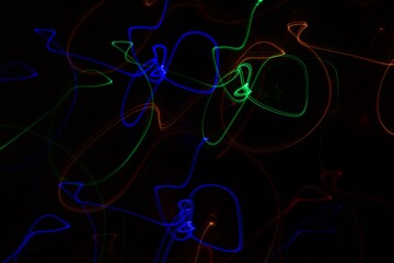 Multicolored neon lights on black background