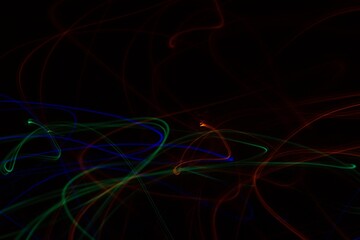 Multicolored neon lights on black background