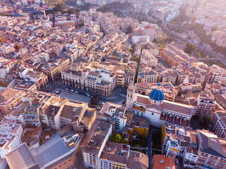Obraz premium View from drone of residential areas of Spanish town of Alcoy with Iglesia arciprestal de Santa Maria