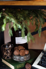 Chocolate truffles in a metal bowl on a book